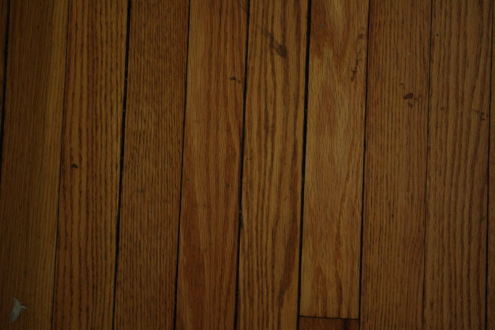 The same floor after professional refinishing in Naperville