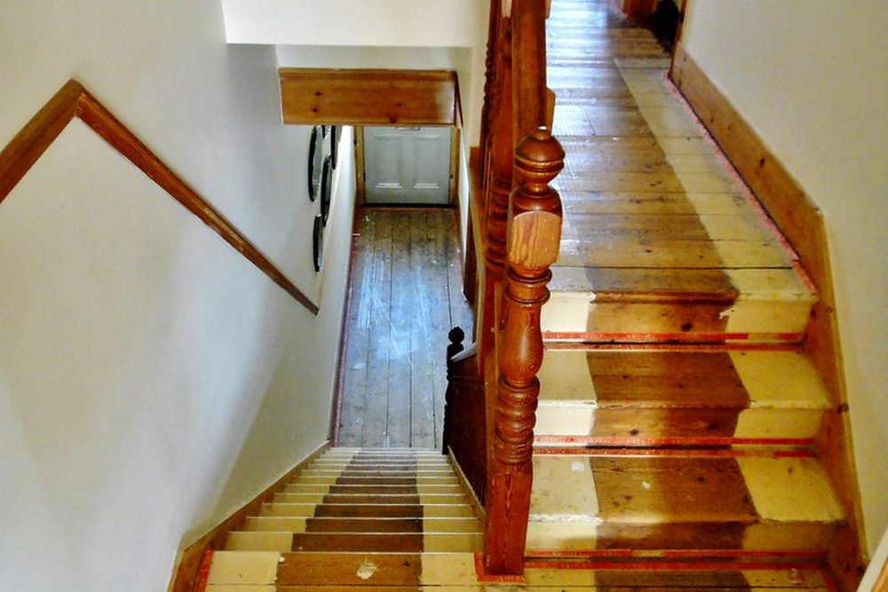 Refinished wooden staircase with a smooth new finish